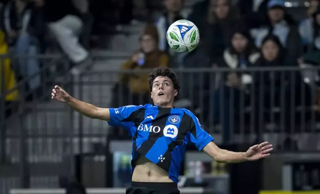 CF Montreal's Caden Clark jumps to head the ball against the Vancouver Whitecaps during the second half of an MLS soccer match in Vancouver, British Columbia, Saturday, March 8, 2025. (Ethan Cairns/The Canadian Press via AP)