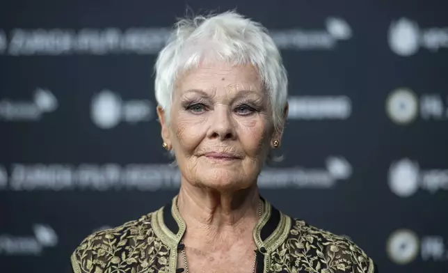 FILE - British actress Judi Dench poses on the Green Carpet before the screening of the movie "Red Joan" at the 14th Zurich Film Festival (ZFF) in Zurich, Switzerland, Wednesday, Oct. 3, 2018. (Patrick Huerlimann/Keystone via AP, File)