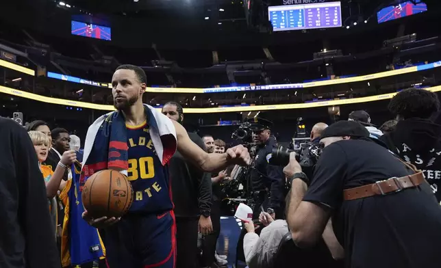 Golden State Warriors guard Stephen Curry (30) walks off the court after the team's victory over the Sacramento Kings in an NBA basketball game Thursday, March 13, 2025, in San Francisco. (AP Photo/Godofredo A. Vásquez)
