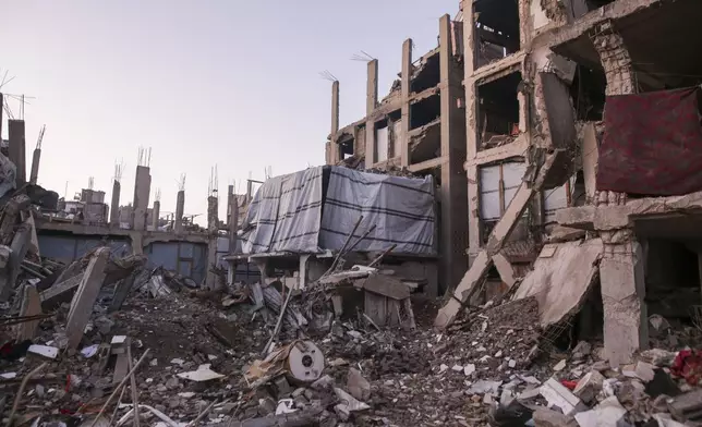 Fabric covers the damaged apartment where Fatima Al-Absi lives in Jabaliya, northern Gaza Strip, on Saturday, March 1, 2025. (AP Photo/Jehad Alshrafi)