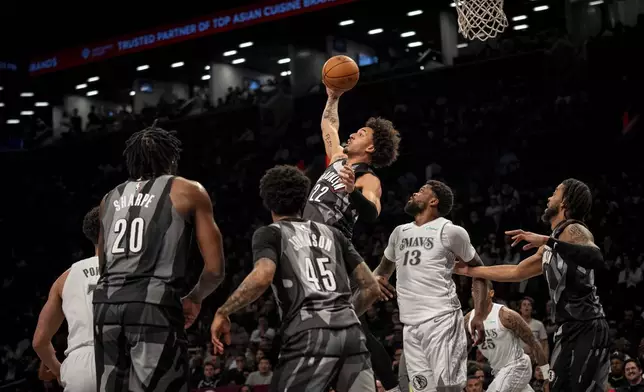 Brooklyn Nets forward Jalen Wilson (22) catches a rebound during the first half of an NBA basketball game against the Dallas Mavericks, Monday, March 24, 2025, in New York. (AP Photo/Angelina Katsanis)