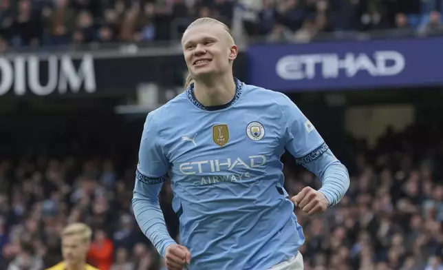 Manchester City's Erling Haaland celebrates after scoring his side's opening goal during the English Premier League soccer match between Manchester City and Brighton and Hove Albion at Etihad stadium in Manchester, England, Saturday, March 15, 2025. (AP Photo/Ian Hodgson)