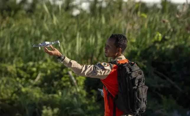 A drone pilot searches for Sudiksha Konanki, a university student from the U.S. who disappeared on a beach in Punta Cana, Dominican Republic, Monday, March. 10, 2025. (AP Photo/Francesco Spotorno)