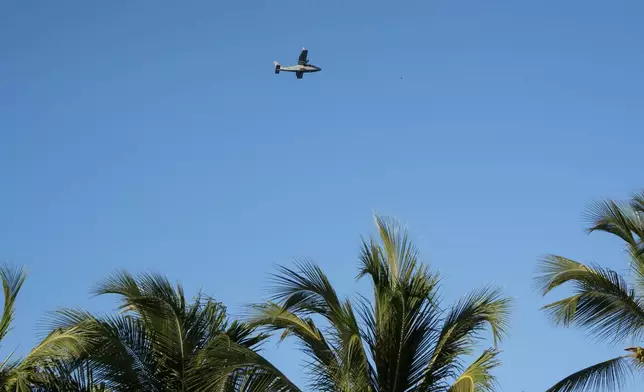 A military plane searches for Sudiksha Konanki, a university student from the U.S. who disappeared on a beach in Punta Cana, Dominican Republic, Monday, March. 10, 2025. (AP Photo/Francesco Spotorno)