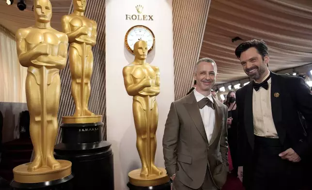 Jeremy Strong, left, and Sebastian Stan arrive at the Oscars on Sunday, March 2, 2025, at the Dolby Theatre in Los Angeles. (AP Photo/John Locher)
