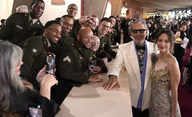 Jeff Goldblum, left, and Emilie Livingston arrive at the Oscars on Sunday, March 2, 2025, at the Dolby Theatre in Los Angeles. (AP Photo/John Locher)