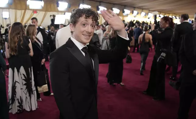 Ethan Slater arrives at the Oscars on Sunday, March 2, 2025, at the Dolby Theatre in Los Angeles. (AP Photo/John Locher)