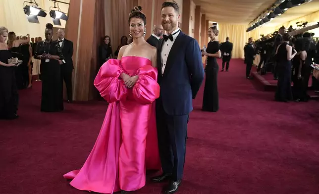 Danya Devorah, left, and D.J. Gugenheim arrive at the Oscars on Sunday, March 2, 2025, at the Dolby Theatre in Los Angeles. (AP Photo/John Locher)