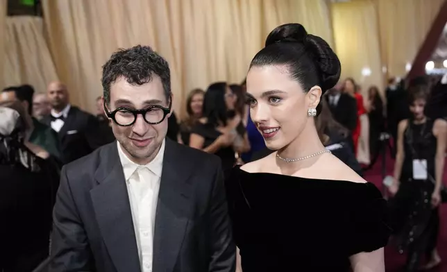 Jack Antonoff, left, and Margaret Qualley arrive at the Oscars on Sunday, March 2, 2025, at the Dolby Theatre in Los Angeles. (AP Photo/John Locher)