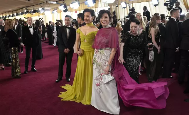Janet Yang, left, and Joan Chen arrive at the Oscars on Sunday, March 2, 2025, at the Dolby Theatre in Los Angeles. (AP Photo/John Locher)