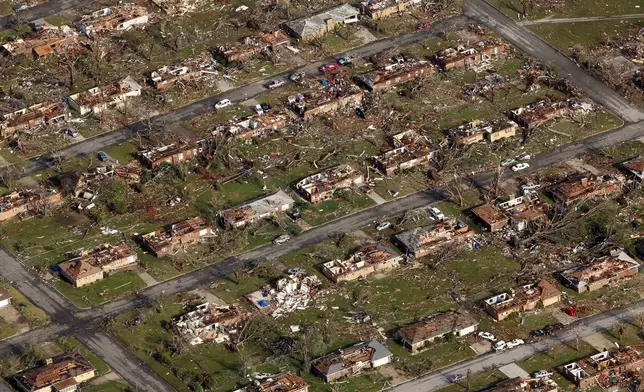 FILE- This aerial photograph shows a neighborhood destroyed by a powerful tornado in Joplin, Mo. Tuesday, May 24, 2011. (AP Photo/Charlie Riedel, File)