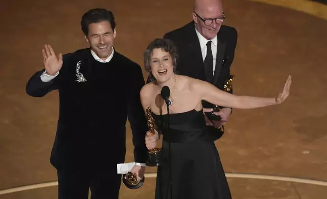 Clement Ducol, from left, Camille, and Jacques Audiard, accept the award for best original song for "El Mal" from" Emilia Perez" during the Oscars on Sunday, March 2, 2025, at the Dolby Theatre in Los Angeles. (AP Photo/Chris Pizzello)