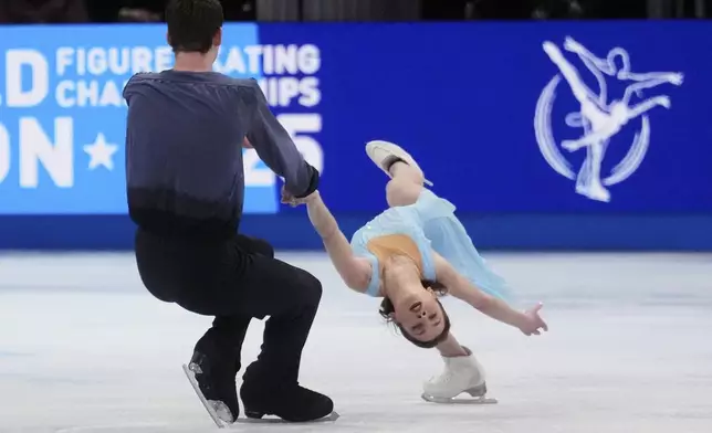 Alisa Efimova and Misha Mitrofanov, of the United States, perform during the pairs free skating program at the figure skating world championships, Thursday, March 27, 2025, in Boston. (AP Photo/Charles Krupa)