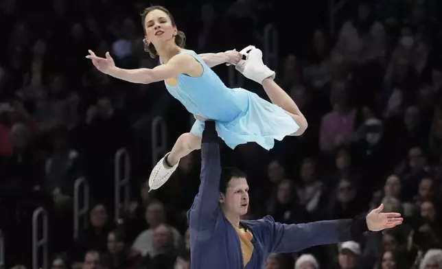 Alisa Efimova and Misha Mitrofanov, of the United States, perform during the pairs free skating program at the figure skating world championships, Thursday, March 27, 2025, in Boston. (AP Photo/Charles Krupa)