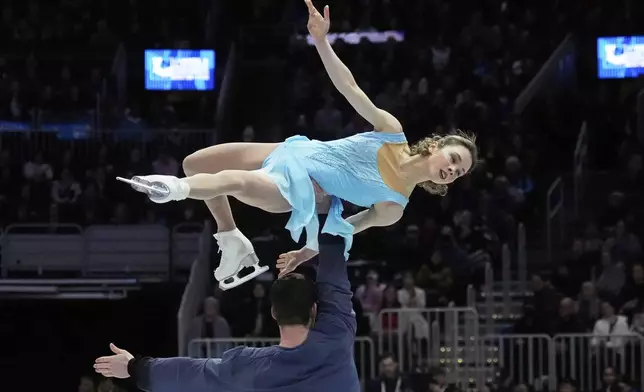 Alisa Efimova and Misha Mitrofanov, of the United States, perform during the pairs free skating program at the figure skating world championships, Thursday, March 27, 2025, in Boston. (AP Photo/Charles Krupa)