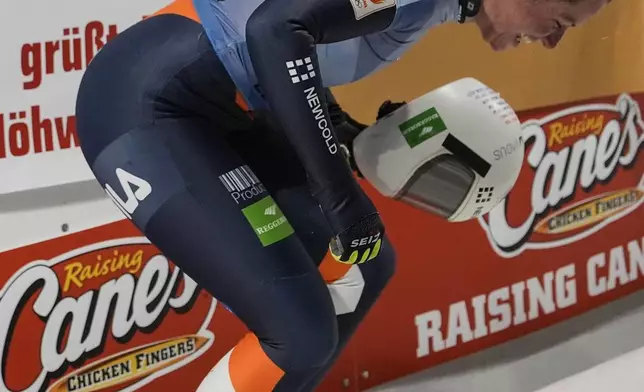 Kimberley Bos, of The Netherlands, leaps in the air during fourth run at the skeleton world championships, Friday, March 7, 2025, in Lake Placid, N.Y. (AP Photo/Julia Demaree Nikhinson)