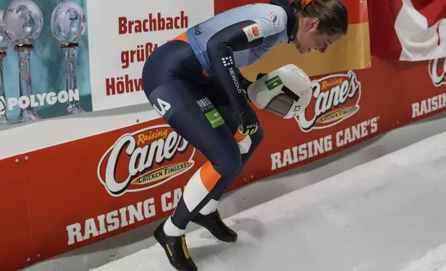 Kimberley Bos, of The Netherlands, leaps in the air during fourth run at the skeleton world championships, Friday, March 7, 2025, in Lake Placid, N.Y. (AP Photo/Julia Demaree Nikhinson)