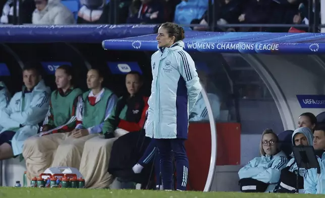 Arsenal's head coach Renee Slegers watches the play during the Women's Champions League quarterfinal first leg soccer match between Real Madrid and Arsenal at the Alfredo di Stefano stadium in Madrid, Spain, Tuesday March 18, 2025. (AP Photo/Fran Berg)