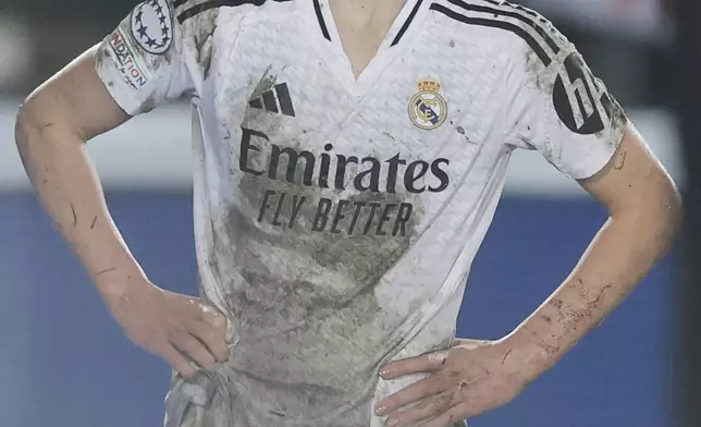 Real Madrid's Melanie Leupolz stands watching after coming off injured during the Women's Champions League quarterfinal first leg soccer match between Real Madrid and Arsenal at the Alfredo di Stefano stadium in Madrid, Spain, Tuesday March 18, 2025. (AP Photo/Fran Berg)