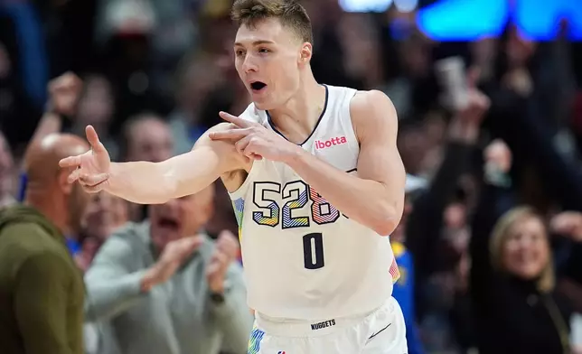 Denver Nuggets guard Christian Braun reacts after hitting a 3-point basket in overtime of an NBA basketball game against the Phoenix Suns, Friday, March 7, 2025, in Denver. (AP Photo/David Zalubowski)