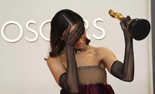 Zoe Saldana, winner of the award for best performance by an actress in a supporting role for "Emilia Perez," poses in the press room at the Oscars on Sunday, March 2, 2025, at the Dolby Theatre in Los Angeles. (Photo by Jordan Strauss/Invision/AP)