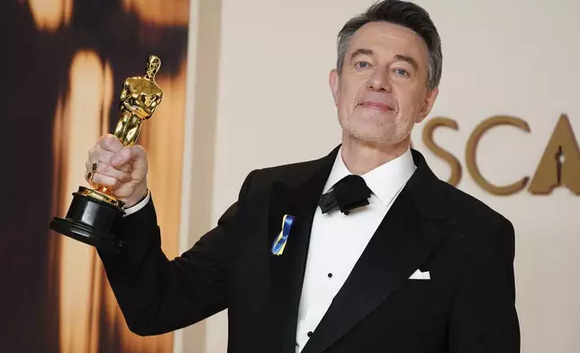 Peter Straughan, winner of the award for best adapted screenplay for "Conclave," poses in the press room at the Oscars on Sunday, March 2, 2025, at the Dolby Theatre in Los Angeles. (Photo by Jordan Strauss/Invision/AP)