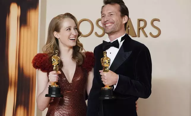 Victoria Warmerdam, left, and Trent, winners of the award for best live action short film for "I'm Not a Robot," pose in the press room at the Oscars on Sunday, March 2, 2025, at the Dolby Theatre in Los Angeles. (Photo by Jordan Strauss/Invision/AP)