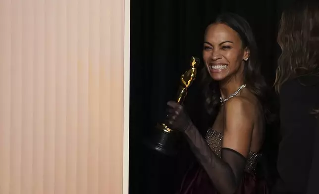 Zoe Saldana, winner of the award for best performance by an actress in a supporting role for "Emilia Perez," poses in the press room at the Oscars on Sunday, March 2, 2025, at the Dolby Theatre in Los Angeles. (Photo by Jordan Strauss/Invision/AP)