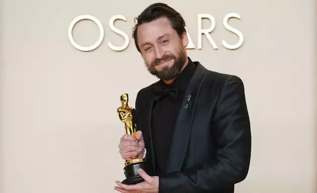 Kieran Culkin poses with the award for best performance by an actor in a supporting role for "A Real Pain" in the press room at the Oscars on Sunday, March 2, 2025, at the Dolby Theatre in Los Angeles. (Photo by Jordan Strauss/Invision/AP)