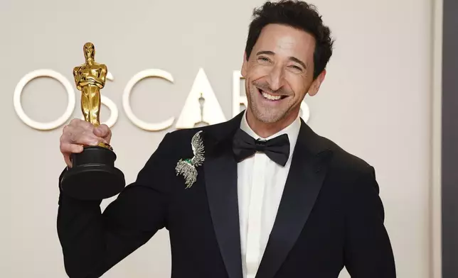 Adrien Brody, winner of the award for best performance by an actor in a leading role for "The Brutalist," poses in the press room at the Oscars on Sunday, March 2, 2025, at the Dolby Theatre in Los Angeles. (Photo by Jordan Strauss/Invision/AP)