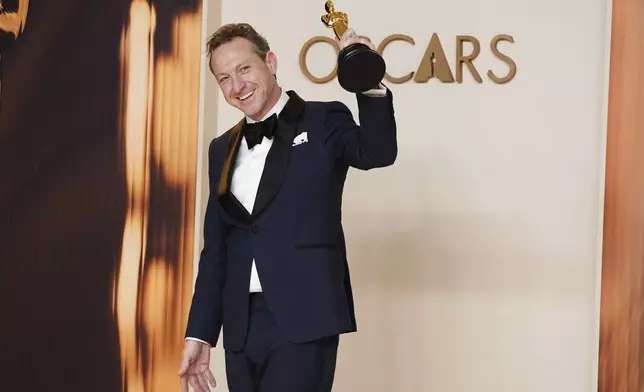 Lol Crawley, winner of the award for best cinematography for "The Brutalist," poses in the press room at the Oscars on Sunday, March 2, 2025, at the Dolby Theatre in Los Angeles. (Photo by Jordan Strauss/Invision/AP)