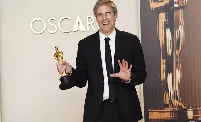 Walter Salles, winner of the award for "I'm Still Here" from Brazil, for best international feature film, poses in the press room at the Oscars on Sunday, March 2, 2025, at the Dolby Theatre in Los Angeles. (Photo by Jordan Strauss/Invision/AP)