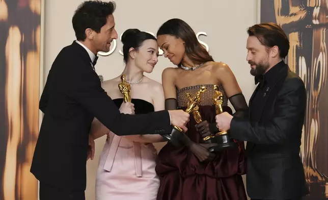 Adrien Brody, from left, winner of the award for best performance by an actor in a leading role for "The Brutalist," Mikey Madison, winner of the award for best performance by an actress in a leading role for "Anora," Zoe Saldana, winner of the award for best performance by an actress in a supporting role for "Emilia Perez," and Kieran Culkin, winner of the award for best performance by an actor in a supporting role for "A Real Pain," pose in the press room at the Oscars on Sunday, March 2, 2025, at the Dolby Theatre in Los Angeles. (Photo by Jordan Strauss/Invision/AP)