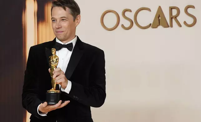 Sean Baker, winner of the award for best film editing for "Anora," poses in the press room at the Oscars on Sunday, March 2, 2025, at the Dolby Theatre in Los Angeles. (Photo by Jordan Strauss/Invision/AP)