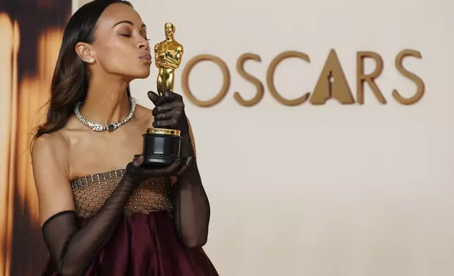 Zoe Saldana, winner of the award for best performance by an actress in a supporting role for "Emilia Perez," poses in the press room at the Oscars on Sunday, March 2, 2025, at the Dolby Theatre in Los Angeles. (Photo by Jordan Strauss/Invision/AP)