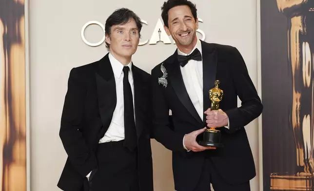 Cillian Murphy, left, and Adrien Brody, winner of the award for best performance by an actor in a leading role for "The Brutalist," pose in the press room at the Oscars on Sunday, March 2, 2025, at the Dolby Theatre in Los Angeles. (Photo by Jordan Strauss/Invision/AP)