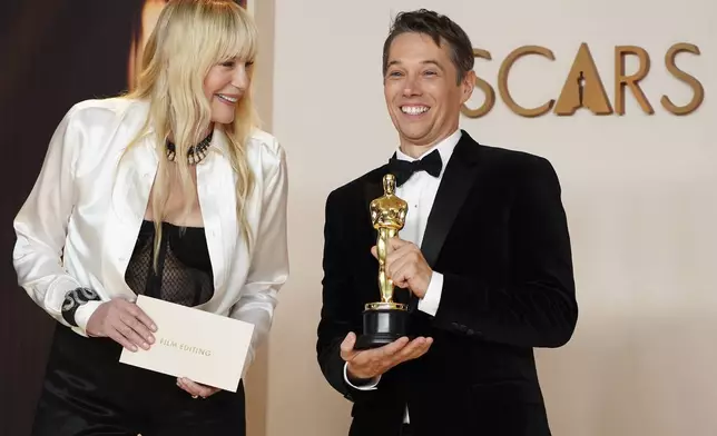 Daryl Hannah, left, and Sean Baker, winner of the award for best film editing for "Anora," pose in the press room at the Oscars on Sunday, March 2, 2025, at the Dolby Theatre in Los Angeles. (Photo by Jordan Strauss/Invision/AP)