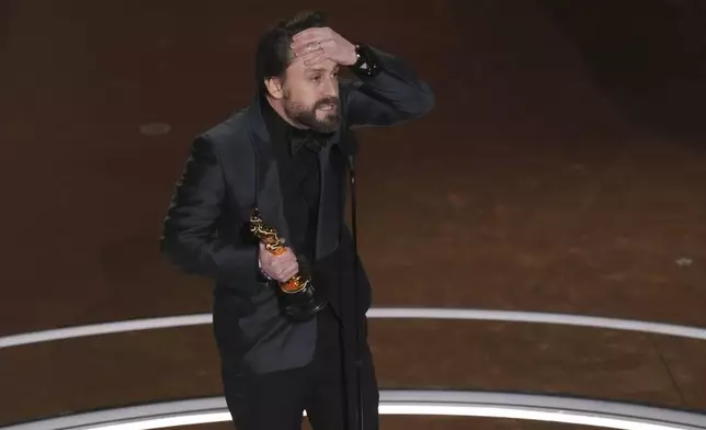 Kieran Culkin accepts the award for best performance by an actor in a supporting role for "A Real Pain" during the Oscars on Sunday, March 2, 2025, at the Dolby Theatre in Los Angeles. (AP Photo/Chris Pizzello)