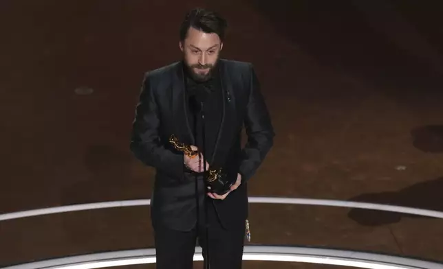 Kieran Culkin accepts the award for best performance by an actor in a supporting role for "A Real Pain" during the Oscars on Sunday, March 2, 2025, at the Dolby Theatre in Los Angeles. (AP Photo/Chris Pizzello)