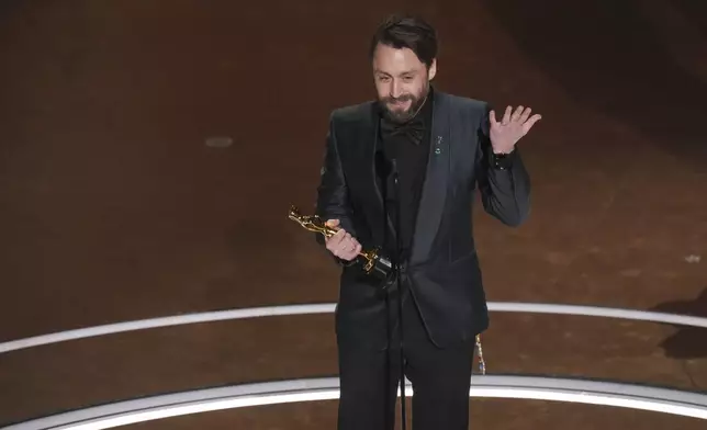 Kieran Culkin accepts the award for best performance by an actor in a supporting role for "A Real Pain" during the Oscars on Sunday, March 2, 2025, at the Dolby Theatre in Los Angeles. (AP Photo/Chris Pizzello)