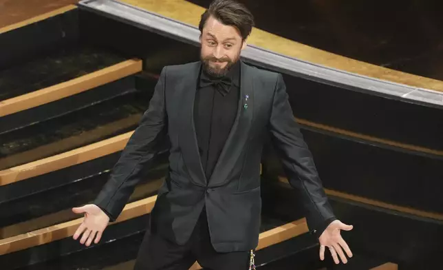 Kieran Culkin accepts the award for best performance by an actor in a supporting role for "A Real Pain" during the Oscars on Sunday, March 2, 2025, at the Dolby Theatre in Los Angeles. (AP Photo/Chris Pizzello)