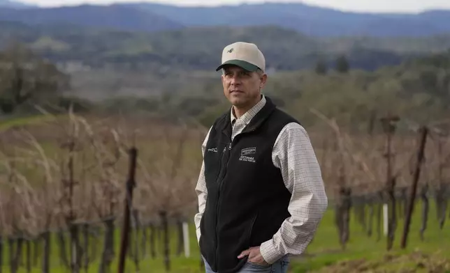Tyler Klick, Partner/Viticulturist of Redwood Empire Vineyard Management, poses for photos while during an interview on AI technology being used in the wine industry in Geyserville, Calif., Friday, Jan. 24, 2025. (AP Photo/Jeff Chiu)