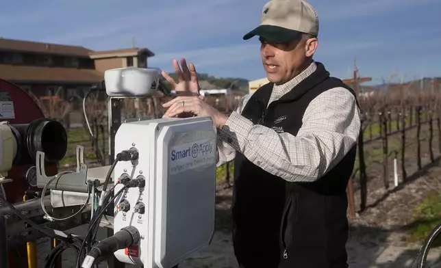 Tyler Klick, Partner/Viticulturist of Redwood Empire Vineyard Management, discusses using NovAtel LiDAR technology, shown at top, and a Smart Apply Intelligent Spray Control System, bottom, during an interview in Geyserville, Calif., Friday, Jan. 24, 2025. (AP Photo/Jeff Chiu)