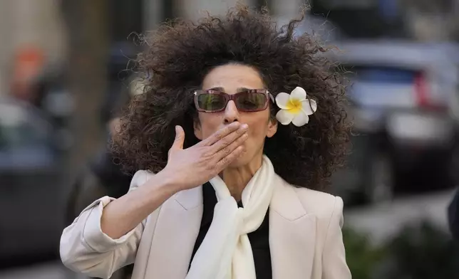 Masih Alinejad blows a kiss to supporters outside the federal courthouse after testifying at the trial of her would-be assassins in New York, Tuesday, March 18, 2025. (AP Photo/Seth Wenig)