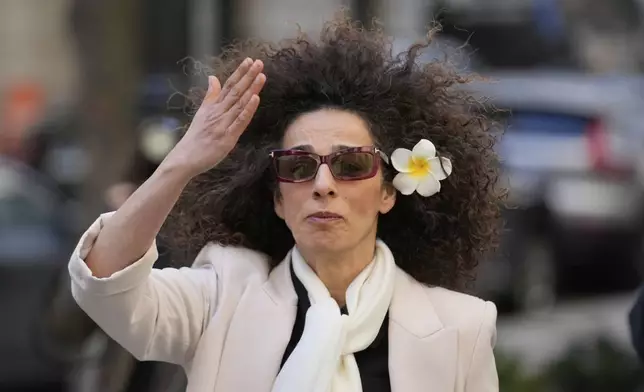 Masih Alinejad blows a kiss to supporters outside the federal courthouse after testifying at the trial of her would-be assassins in New York, Tuesday, March 18, 2025. (AP Photo/Seth Wenig)