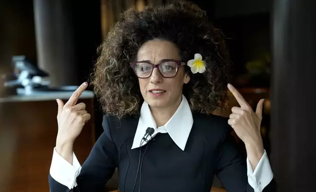 FILE - Masih Alinejad, 48, a prominent Iranian American human rights activist gives an interview Press in Berlin, Nov. 9, 2024. (AP Photo/Ebrahim Noroozi, File)