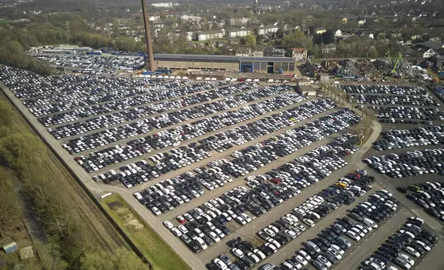 New German cars are stored at a logistic center in Essen, Germany, Thursday, March 27, 2025. (AP Photo/Martin Meissner)
