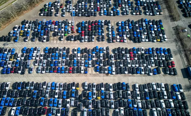 Opel cars are parked on the ground of the Opel car factory in Ruesselsheim near Frankfurt, Germany, Thursday, March 27, 2025. (AP Photo/Michael Probst)