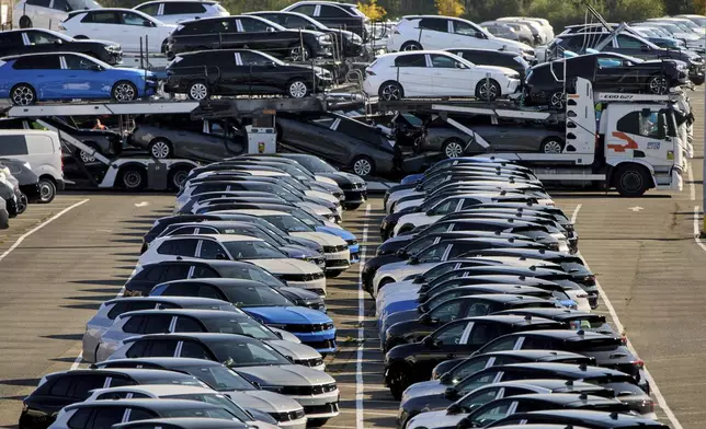 Opel cars are parked on the ground of the Opel car factory in Ruesselsheim near Frankfurt, Germany, Thursday, March 27, 2025. (AP Photo/Michael Probst)