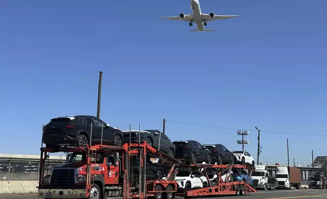 New automobiles are loaded at the Port Newark Container Terminal in Newark, N.J., on Thursday, March 27, 2025. (AP Photo/Ted Shaffrey)
